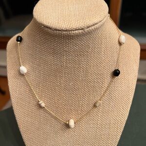 Monet 16” necklace with black, white and tan beads on gold tone chain